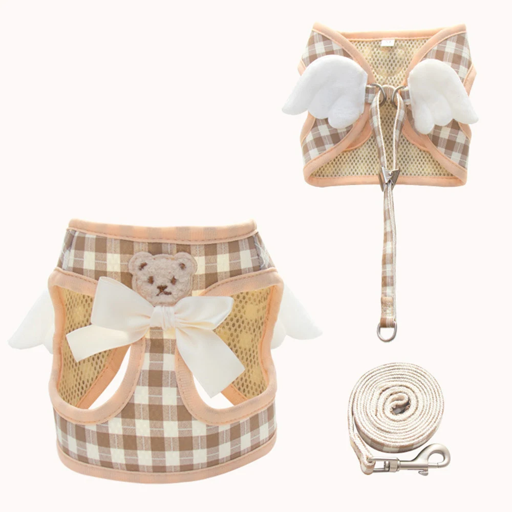 Plaid dog harness with white angel wings, teddy bear patch, and bow shown with matching leash