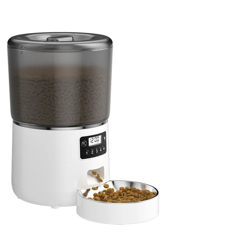 A white and grey automatic pet food dispenser with a stainless steel bowl filled with kibble.