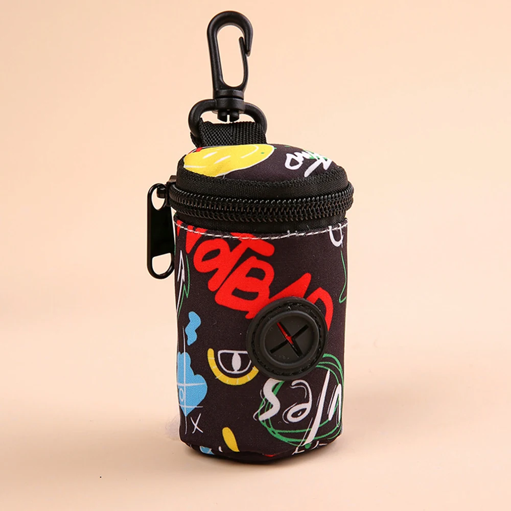 A small black cylindrical pouch with colorful graffiti-style patterns, a zipper, and a carabiner clip.