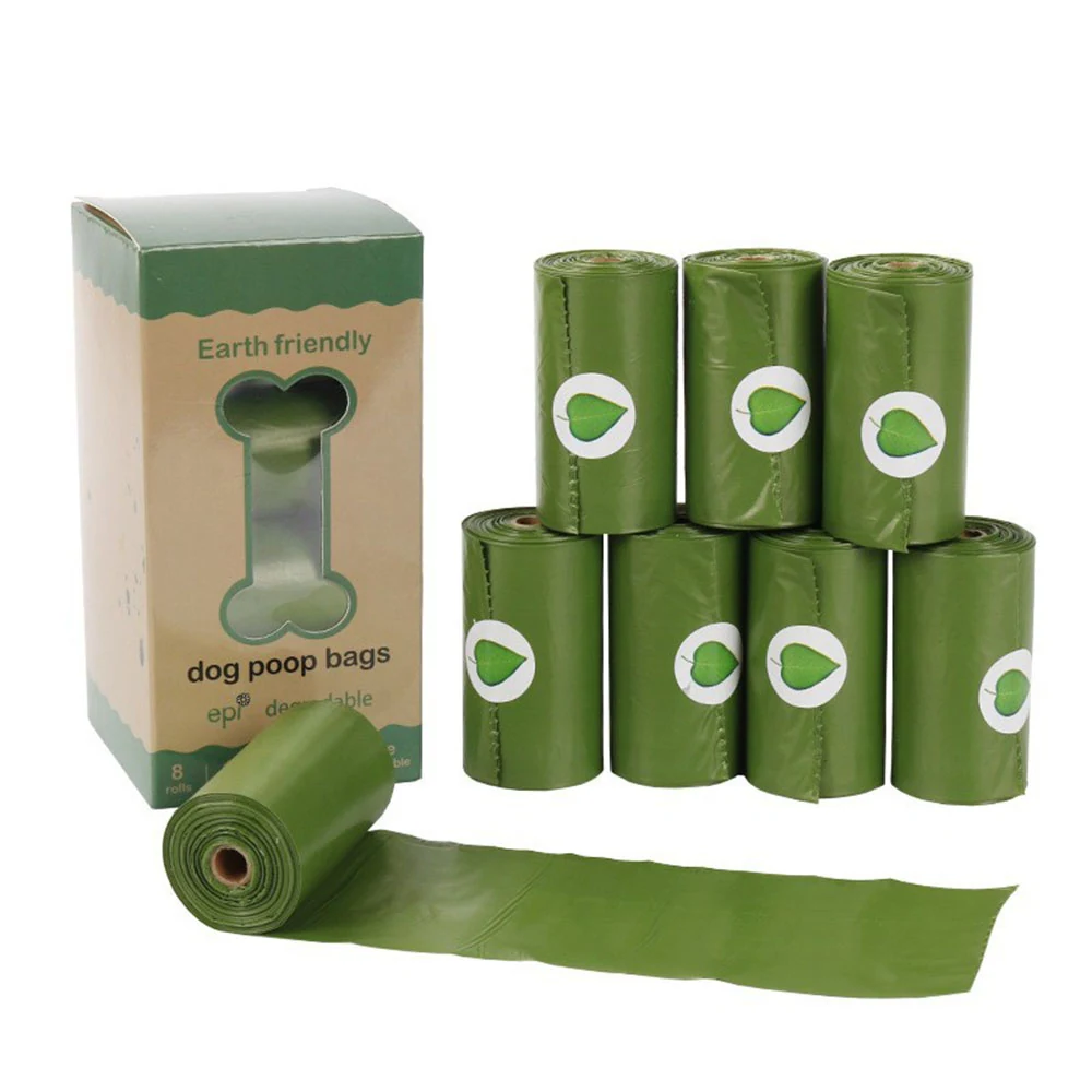 Green rolls of dog poop bags and packaging box