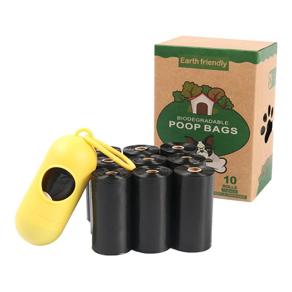 A set of black biodegradable poop bag rolls with a yellow dispenser and a cardboard box.