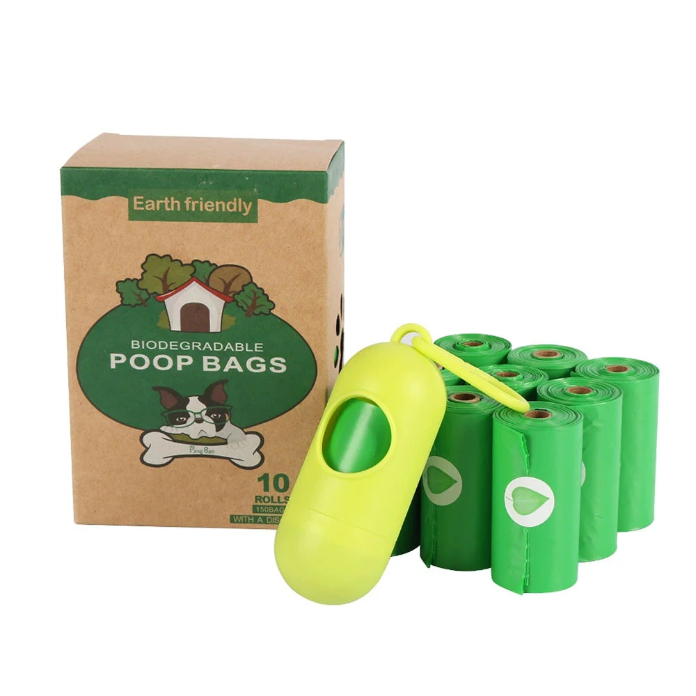 Box of biodegradable dog poop bags with a green plastic dispenser and several rolls of bags.