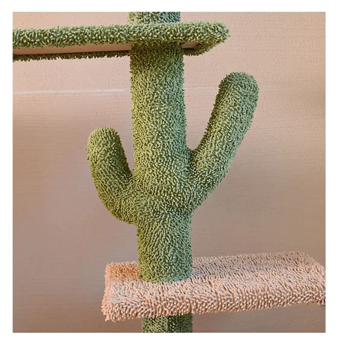 Close-up of a green cactus-shaped cat tree post with textured carpet and a platform