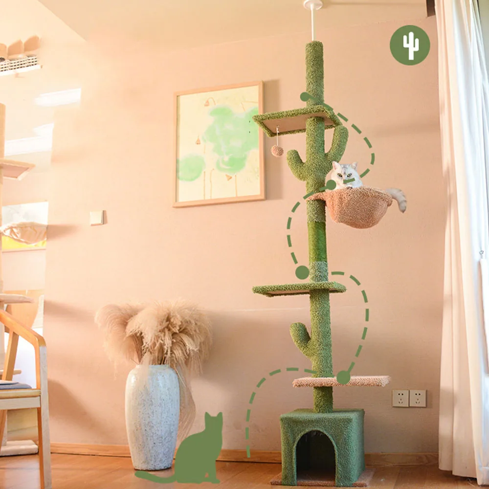 Tall, green, sisal-wrapped cat tree with multiple platforms and a cactus design, placed in a living room.