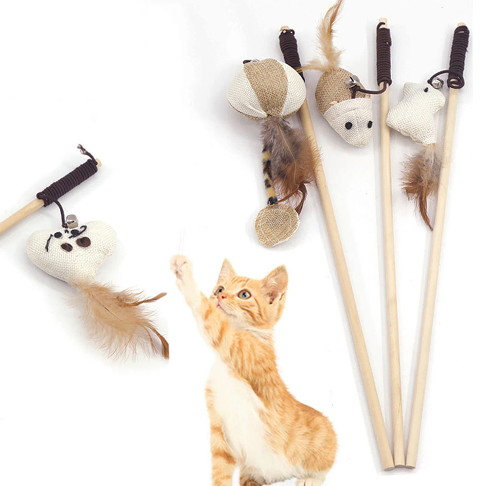 Several cat teaser wands with plush mouse heads and feathers arranged with a ginger cat reaching up.