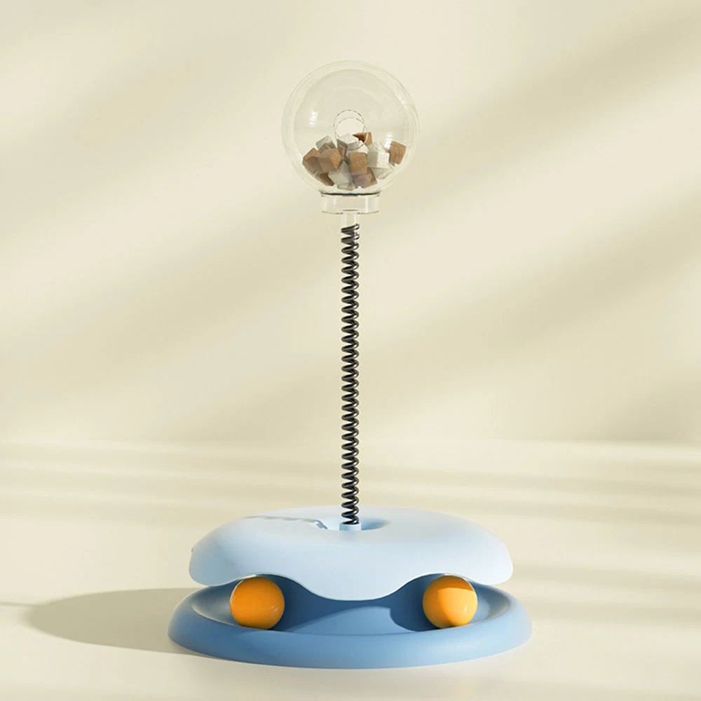 Vertical blue pet treat dispenser toy with a clear ball on a spring