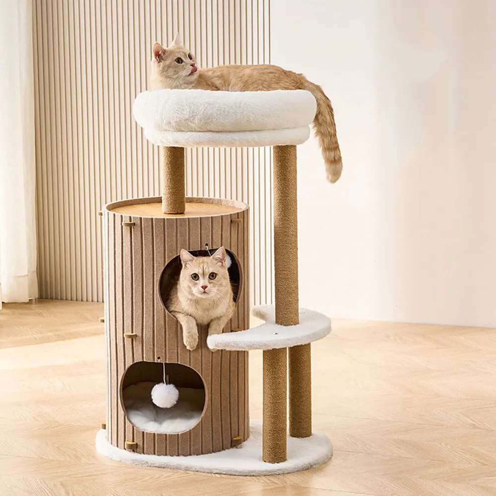 Beige cat tree with a top perch and two cylindrical cubbies, occupied by two cream cats.