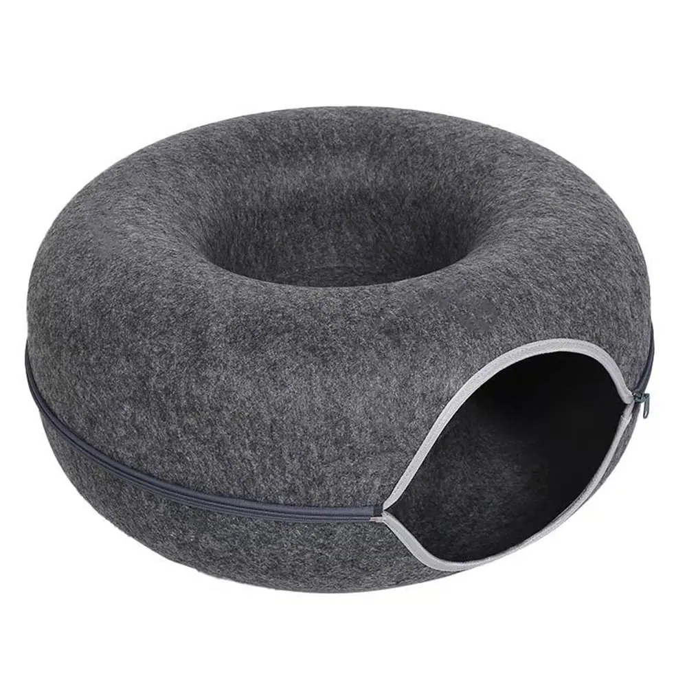 Grey felt donut-shaped pet bed with a side opening and zipper.