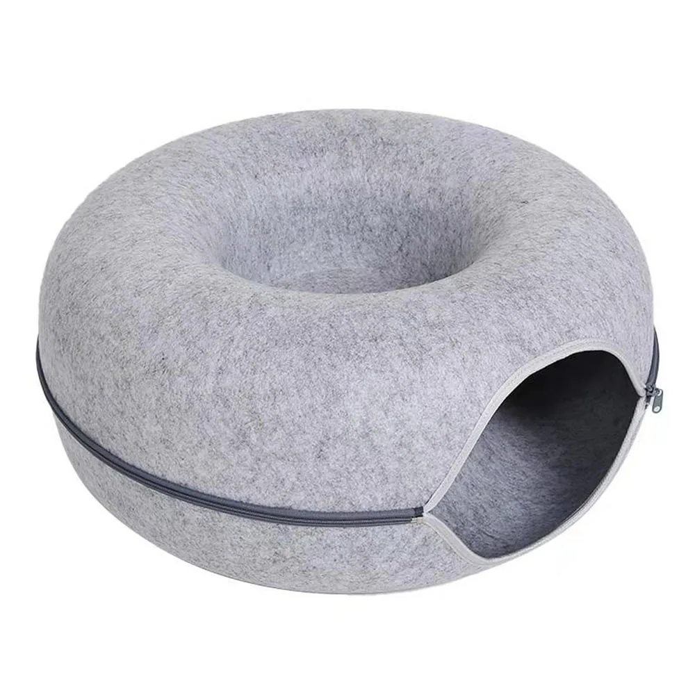 Grey felt torus-shaped cushion with a zipper and opening on the side.