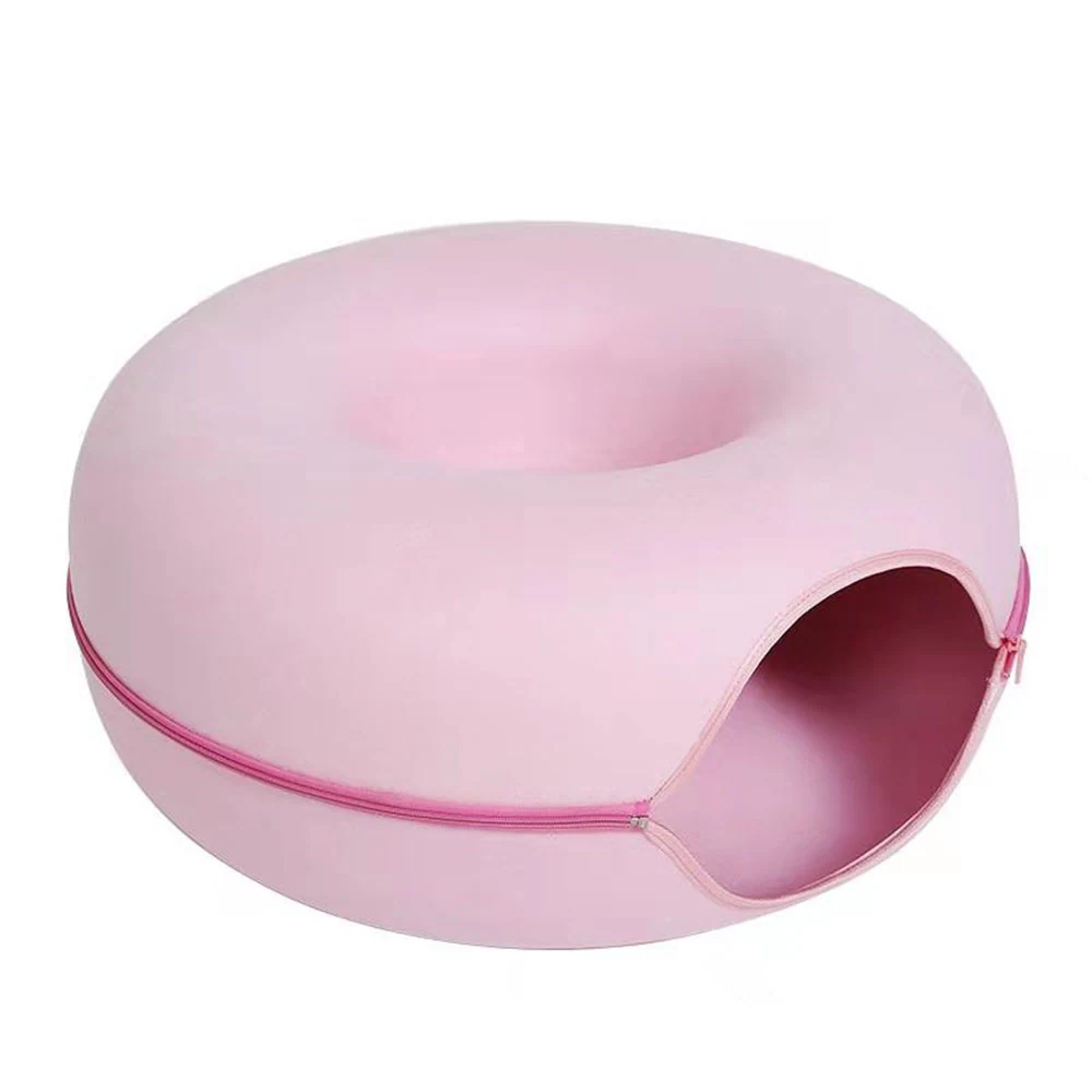 Pink donut-shaped soft shell with a zipper opening around the side.