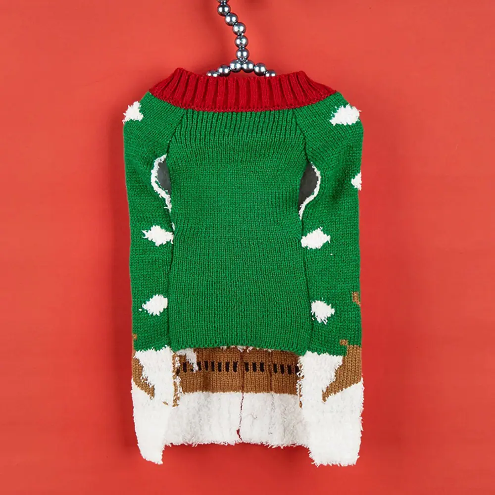 Green knitted sweater with a red collar and white snowflake pattern hanging on a silver chain.