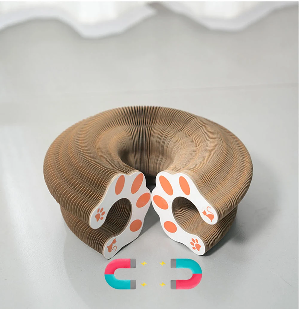 A brown, accordion-style cardboard cat tunnel toy shaped like a donut with paw print designs on the ends.