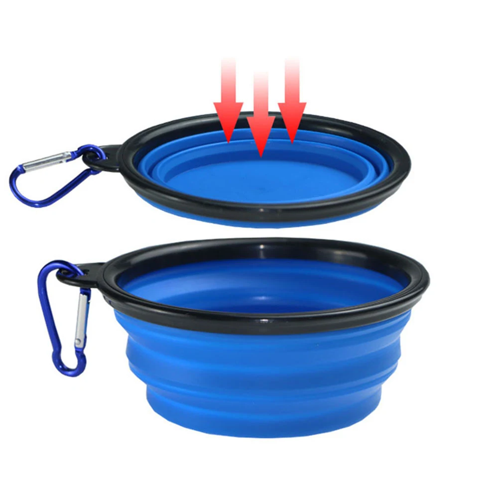 A blue collapsible silicone bowl with a black rim and carabiner, shown folded and expanded with arrows indicating the folding action.