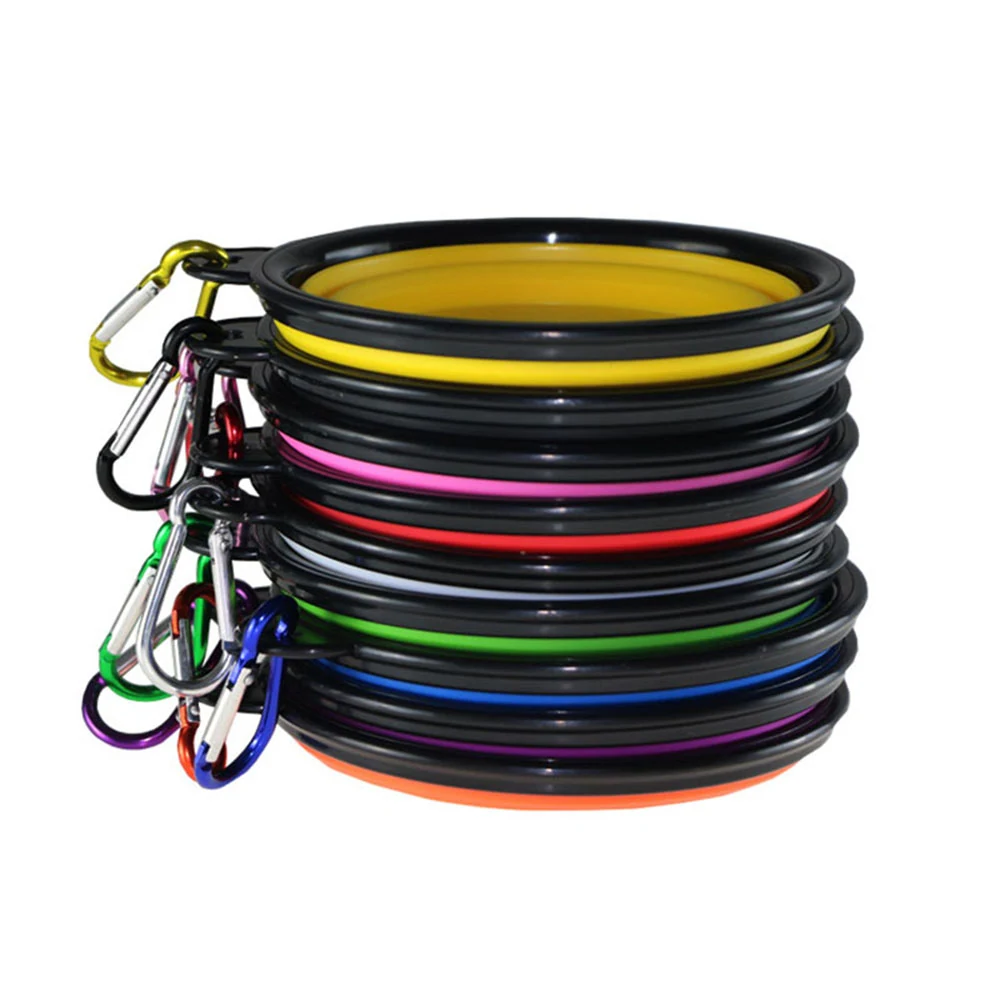 A stack of colorful collapsible silicone dog bowls with carabiners attached.