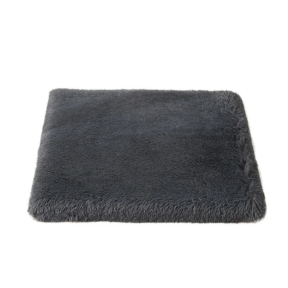 Grey rectangular plush rug with high pile texture