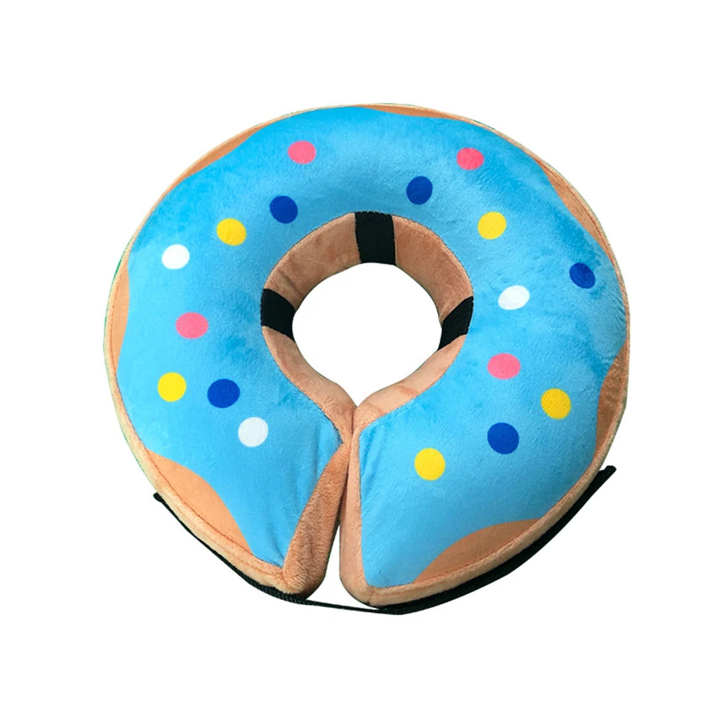A plush donut-shaped neck pillow with blue frosting and colorful sprinkles.