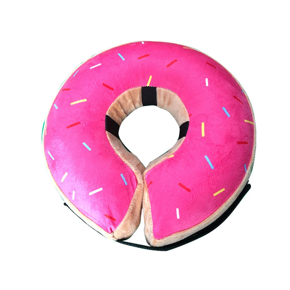Pink donut shaped neck pillow with sprinkles