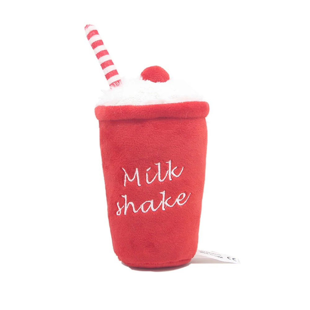 Red plush milkshake toy with white foam, cherry, and striped straw on a white background