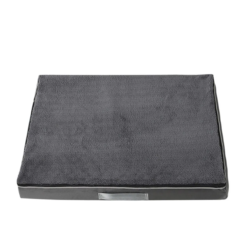 Dark grey rectangular cushion with a soft fabric top and a carrying handle.