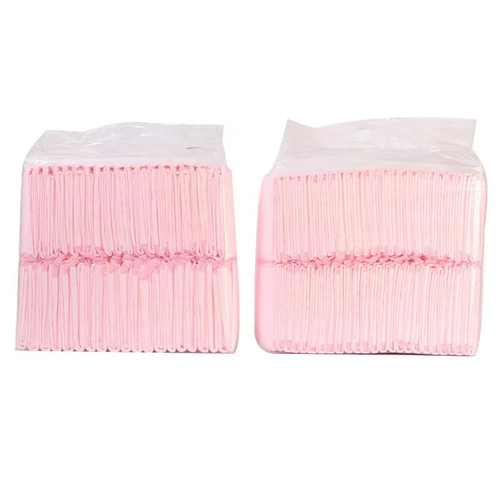 Two large, clear plastic bags stacked with pink cotton swabs.