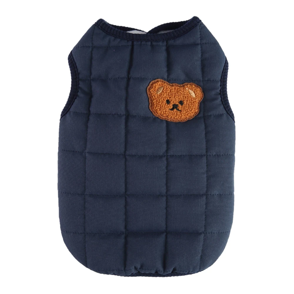 Navy blue quilted vest with an embroidered bear face patch on the chest