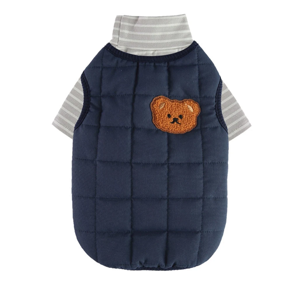 Navy blue quilted vest with an embroidered bear patch, layered over a grey and white striped turtleneck.