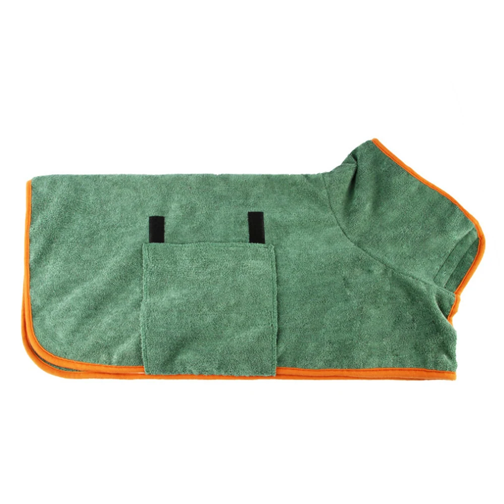 Green microfiber towel with orange trim and a pocket featuring two black tabs