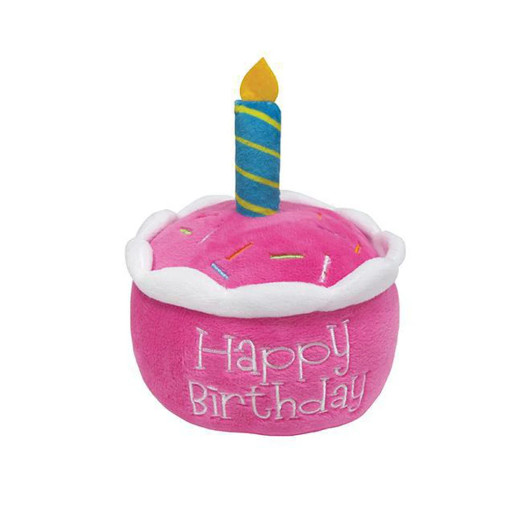 Pink plush birthday cake toy with a blue and green striped candle