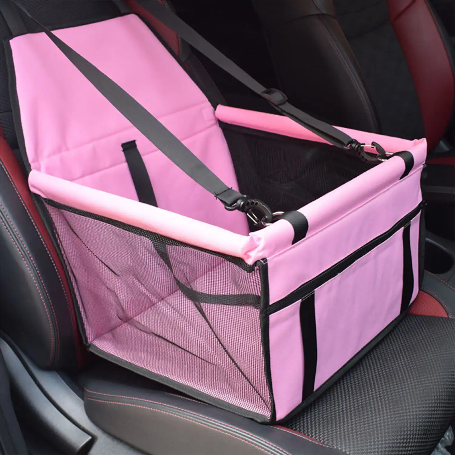 Pink fabric pet car seat carrier with black mesh sides and safety straps