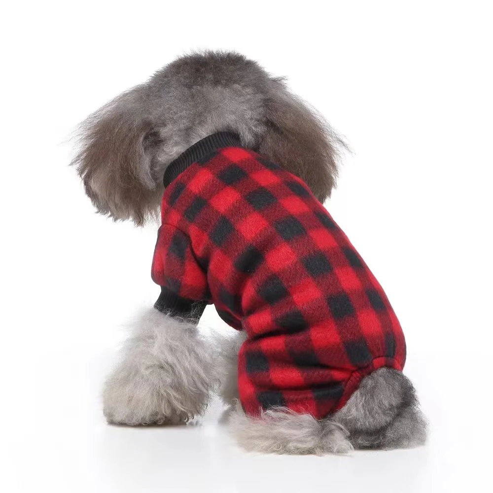 Grey poodle viewed from behind wearing a red and black plaid dog sweater