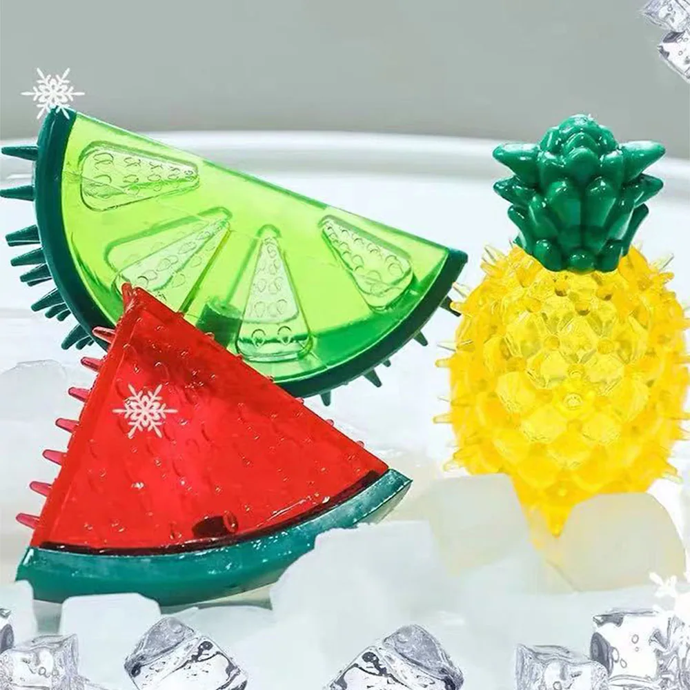 Watermelon and pineapple shaped drink garnish tools on ice