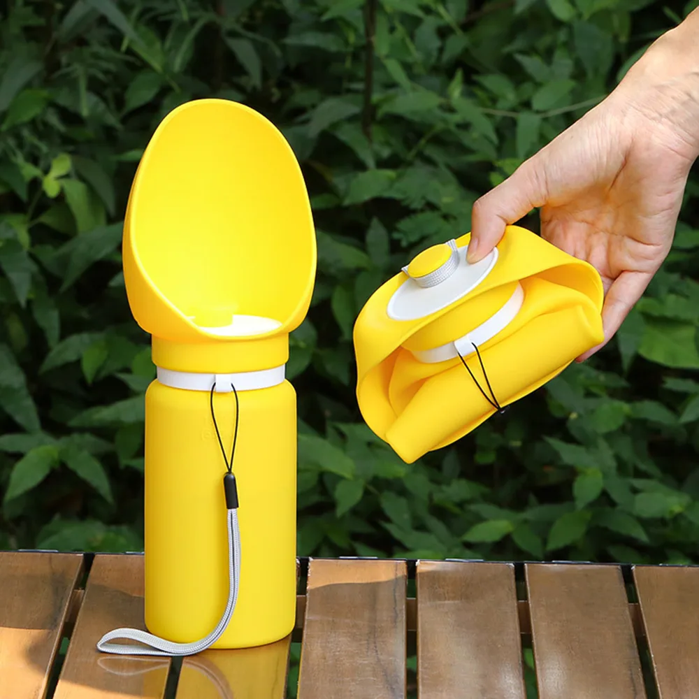 A yellow collapsible silicone water bottle shown in both its expanded and folded states.
