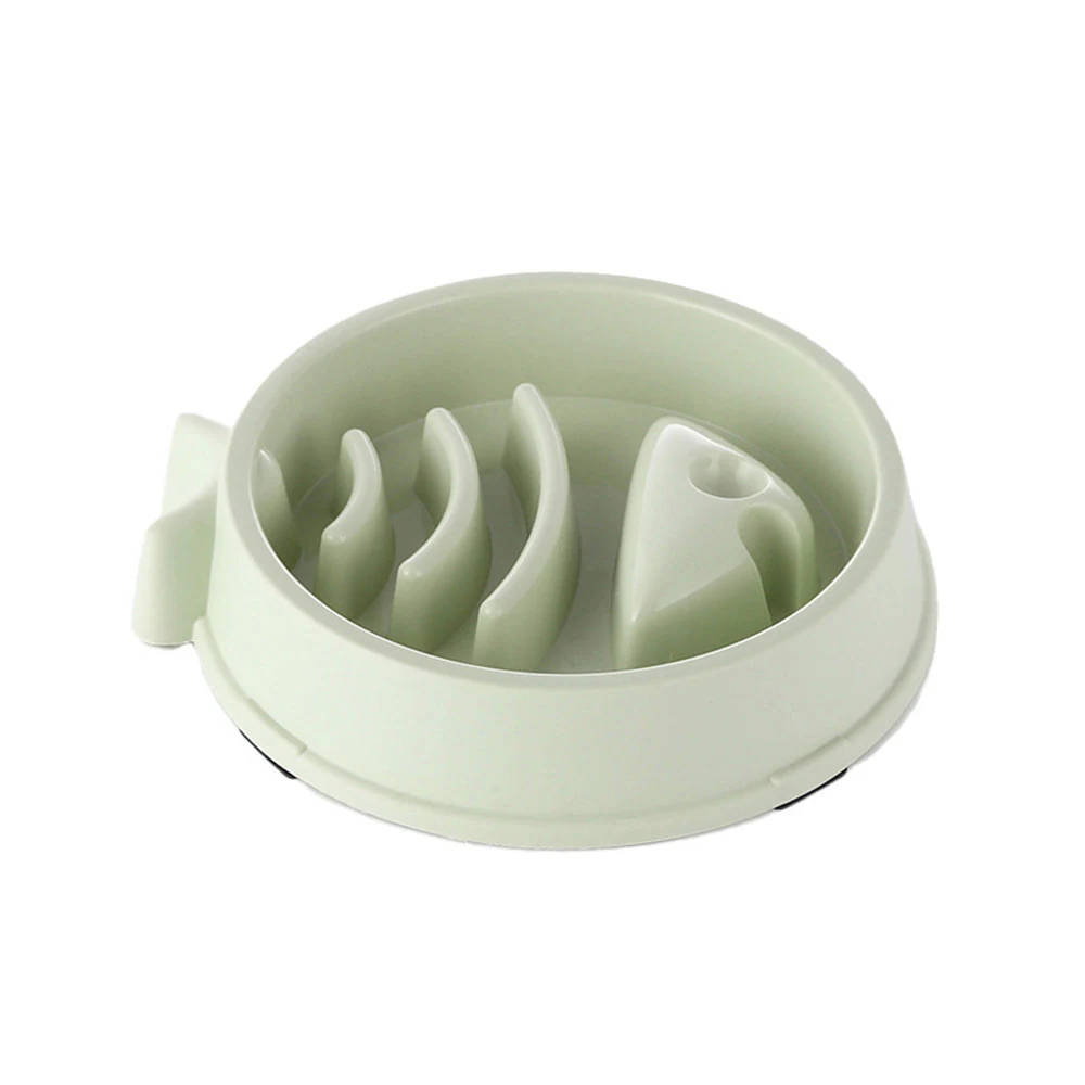 Light green plastic slow feeder bowl with internal maze obstacles on a white background
