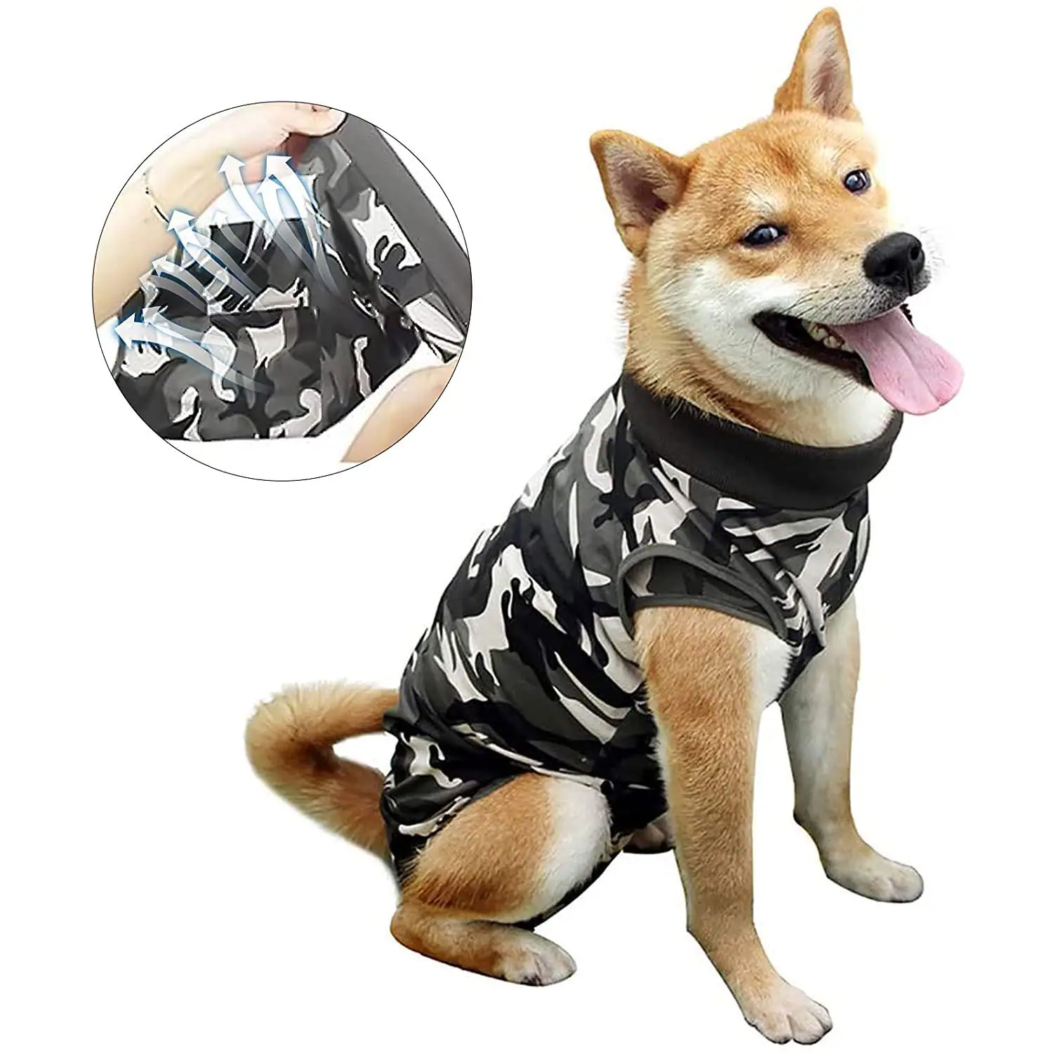 A Shiba Inu dog wearing a black and white camouflage raincoat.