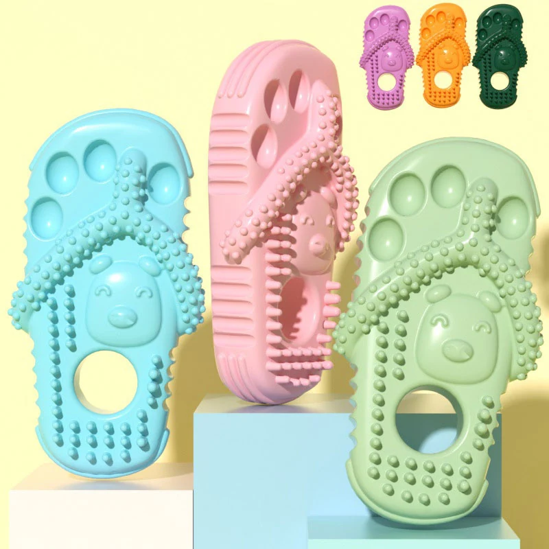 Three colorful textured foot massager slippers with toe grips and bear face design displayed on pedestals