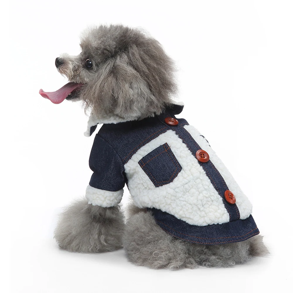 Gray poodle sitting in profile wearing a denim and white sherpa coat with brown buttons.
