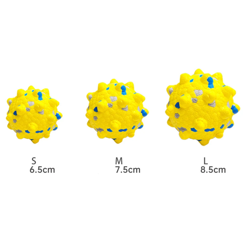 Three yellow spiky balls with blue markings in small, medium, and large sizes.