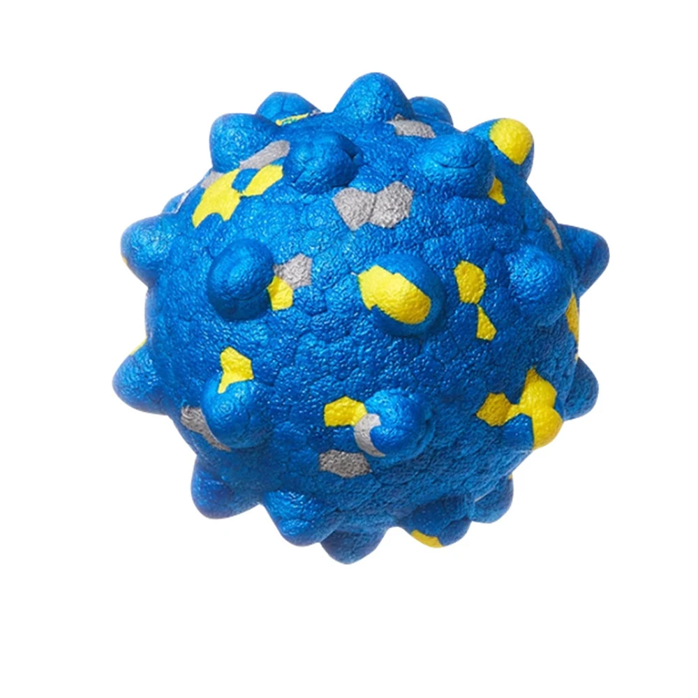 A blue spiky rubber ball with yellow and grey spots on a white background.