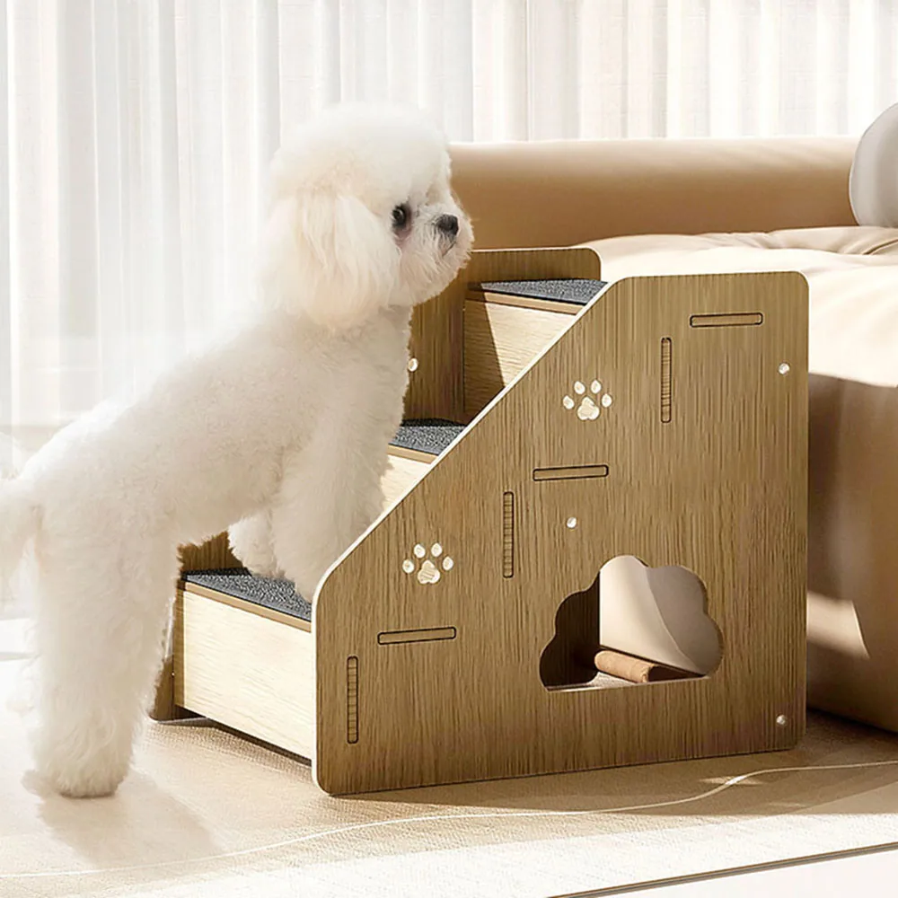 White dog using wooden pet stairs to climb onto a sofa