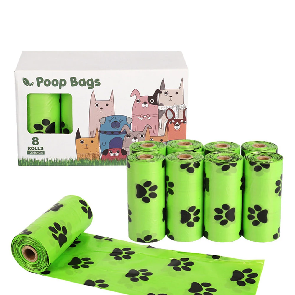 A box of 8 rolls of green dog poop bags with black paw prints, with several rolls displayed next to it.