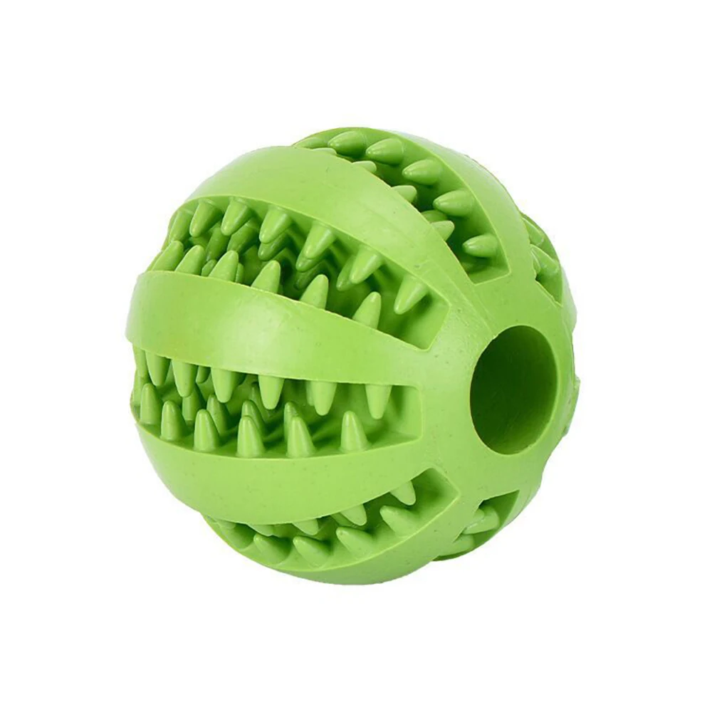 Green rubber dog chew toy ball with spikes and a central hole