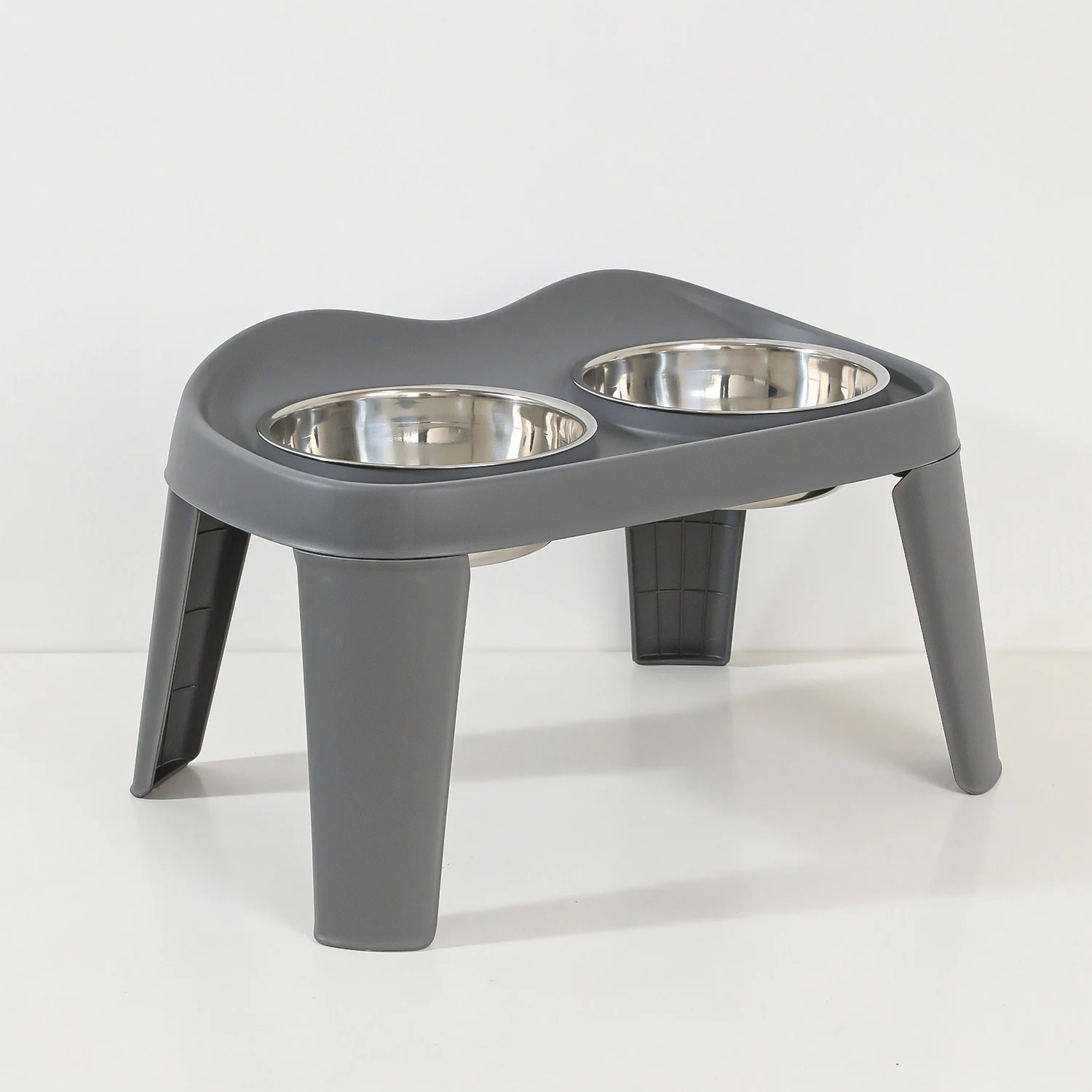 Grey elevated plastic pet bowl stand with two stainless steel bowls