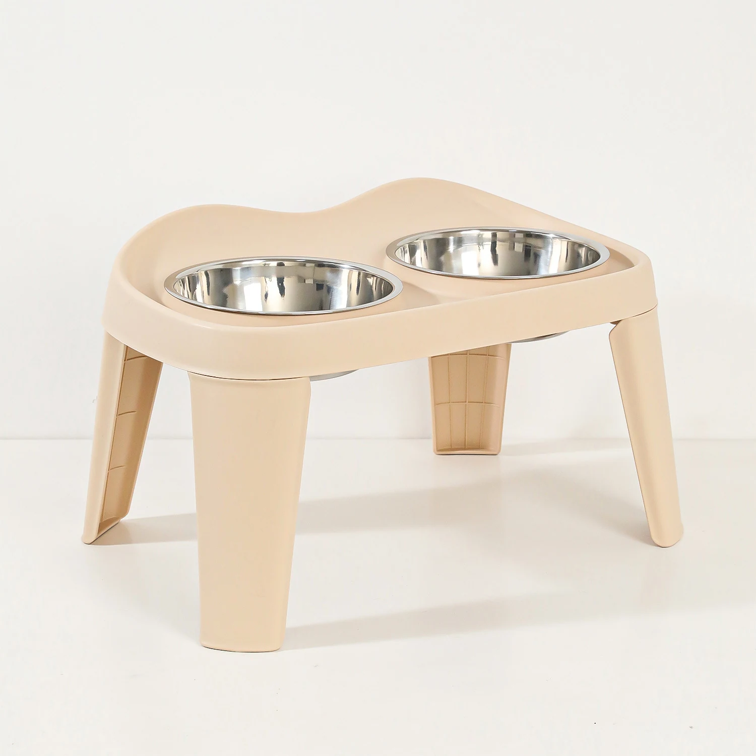 Beige elevated pet feeder stand with two stainless steel bowls