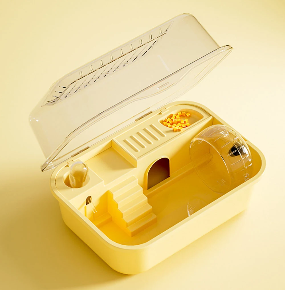 Yellow plastic hamster cage with clear lid, featuring an exercise wheel, food bowl, and stairs.