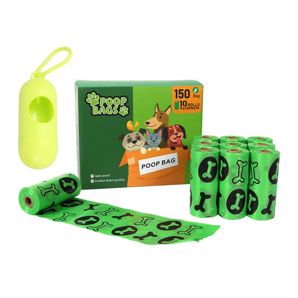 Green dog poop bag dispenser and rolls of bags with bone patterns next to packaging box.
