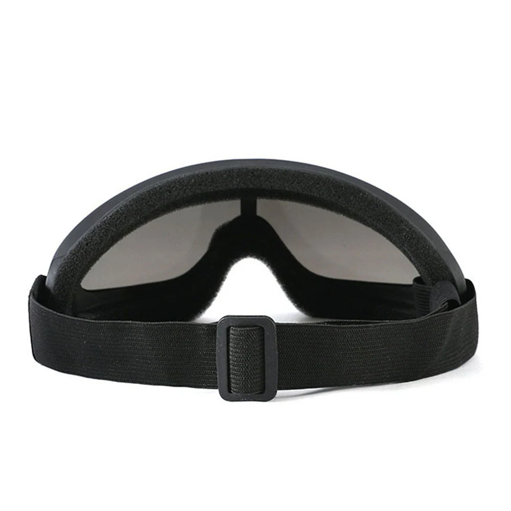 Rear view of black protective goggles with foam padding and an adjustable elastic head strap.