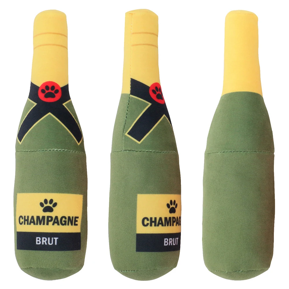 Three plush green and yellow champagne bottle dog toys with paw prints on a white background