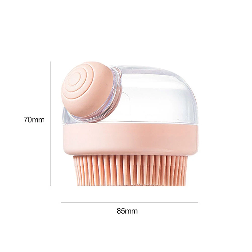 Pink silicone shampoo brush with clear storage dome and measurement lines.