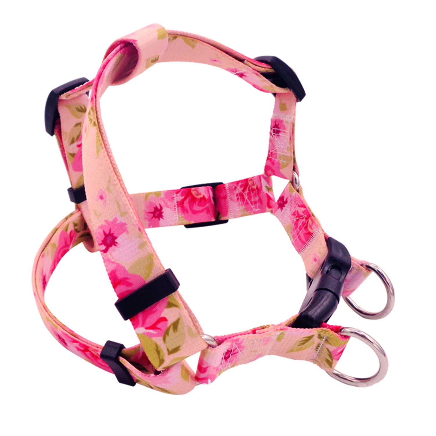 Pink floral patterned dog harness with black plastic buckles and metal D-rings on a white background