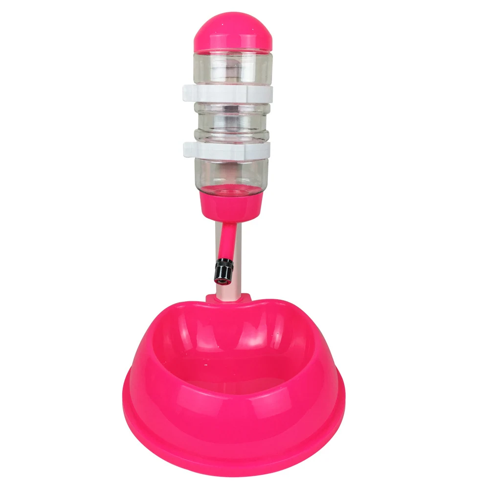 Pink automatic poultry waterer with clear reservoir and base bowl on white background